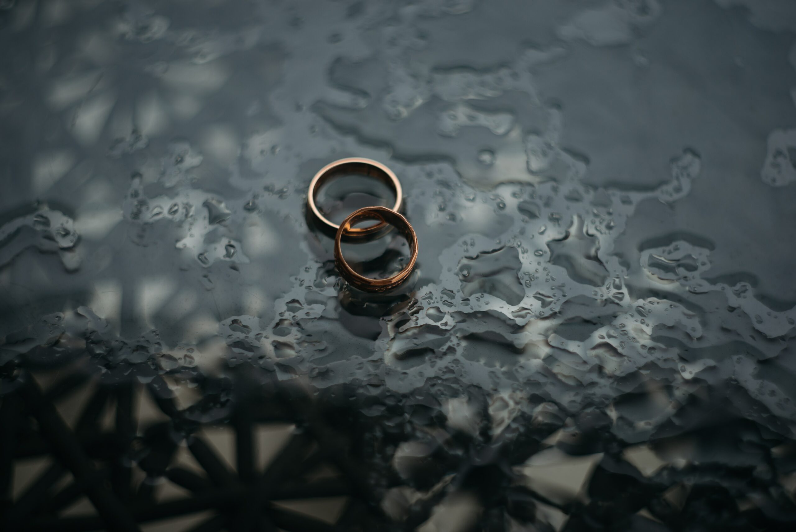 Two wedding rings in the rain