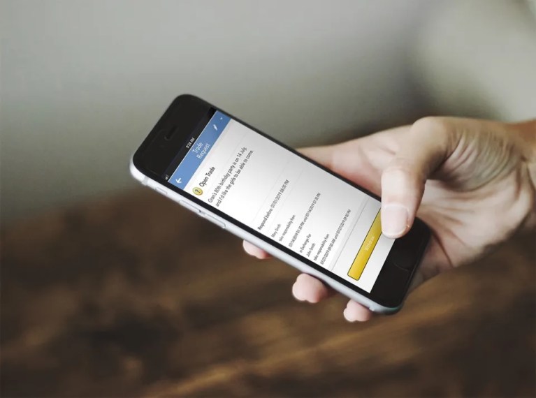 Person using OurFamilyWizard app as co-parenting tool